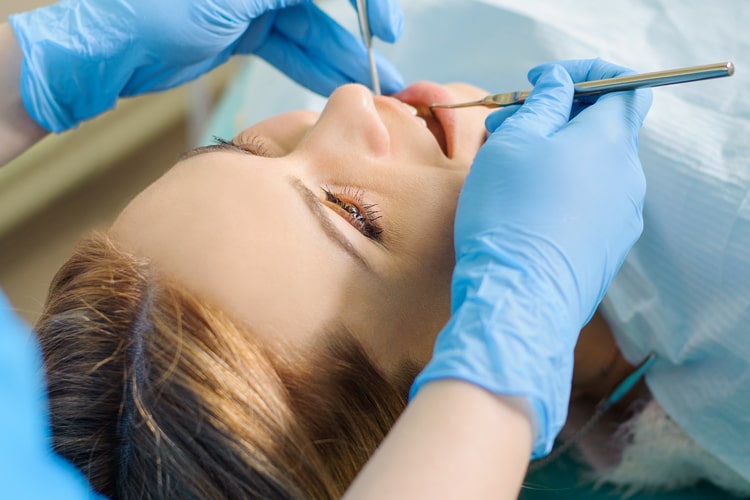 A woman undergoing an oral surgery