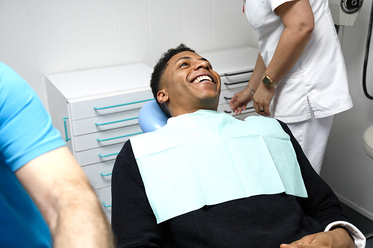 A young man reclining in a dental chair
